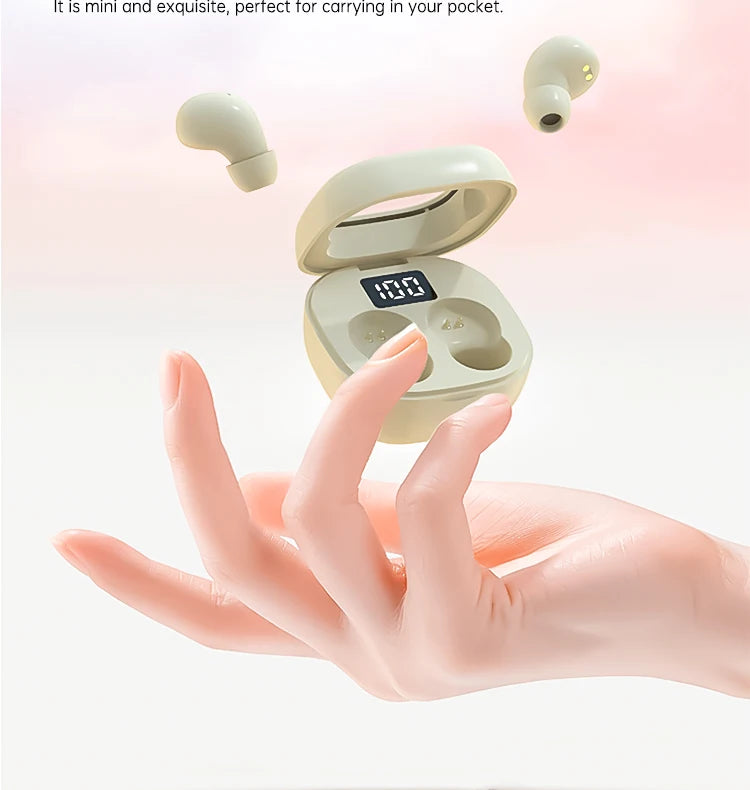 A hand holds an open mini Bluetooth earphone case with a glowing display, showing the earphones inside.