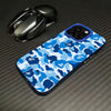 A blue and white leopard print anti-fall phone case is shown next to a silver phone case.