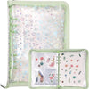A clear plastic organizer binder for stickers with multiple storage pockets and a green border.