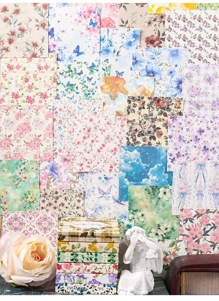 A collection of vintage floral square scrapbook paper sheets featuring various pink, blue, and green botanical patterns.