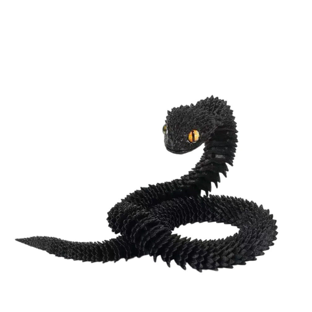 A black articulated 3D printed snake figurine with yellow eyes coiled on a white background.