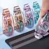 A hand holds several colorful heavy duty double-sided adhesive tapes with clear packaging against a blue background.