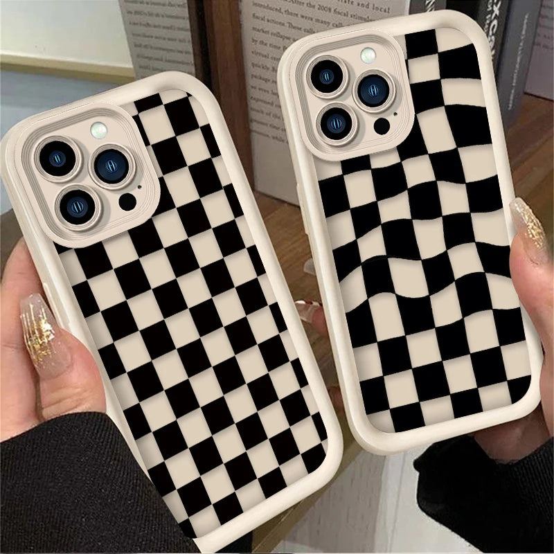 A pair of black and white checkered silicone phone cases displayed on a hand.