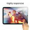 A hand touches a tablet displaying an Avatar game with a fiery background, demonstrating the highly responsive screen.