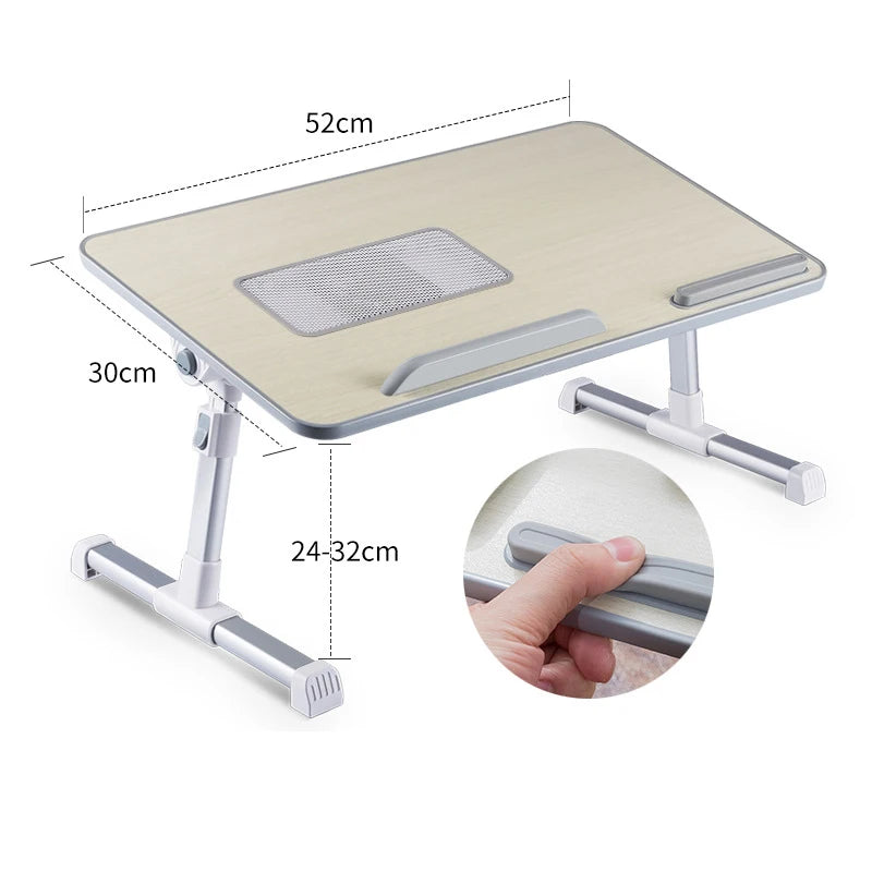 A portable adjustable laptop desk stand with a light wood-colored surface and silver metal supports.