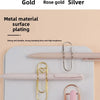 Elegant metal pen clips in gold, rose gold, and silver finishes displayed on a white surface.