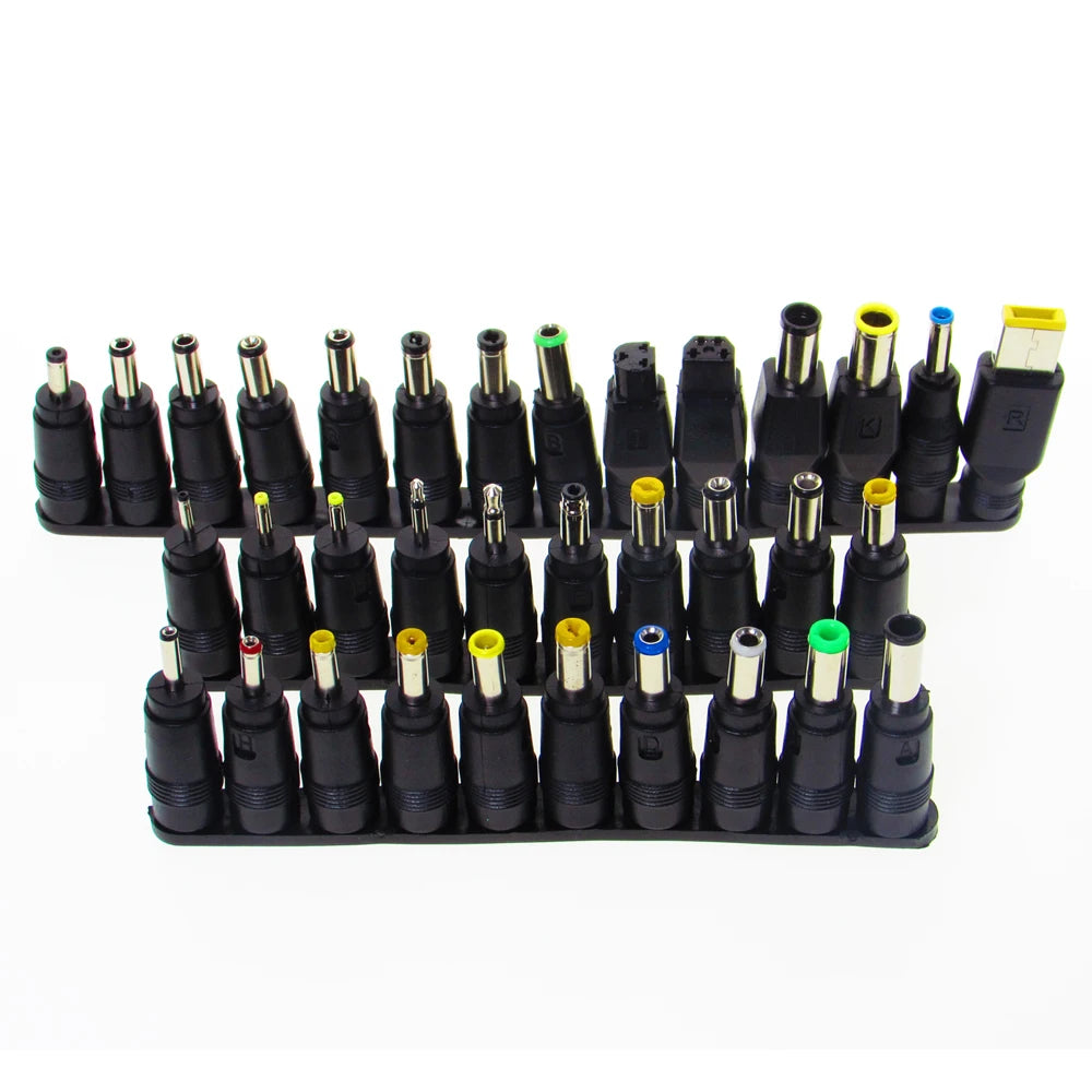 A collection of 34 universal laptop charger connector tips in various colors and sizes.