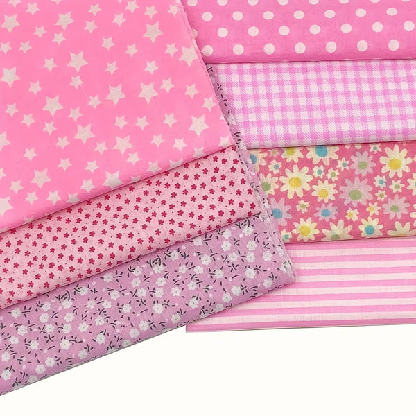 A stack of pink cotton patchwork fabric squares featuring various patterns including polka dots, gingham, and floral prints.