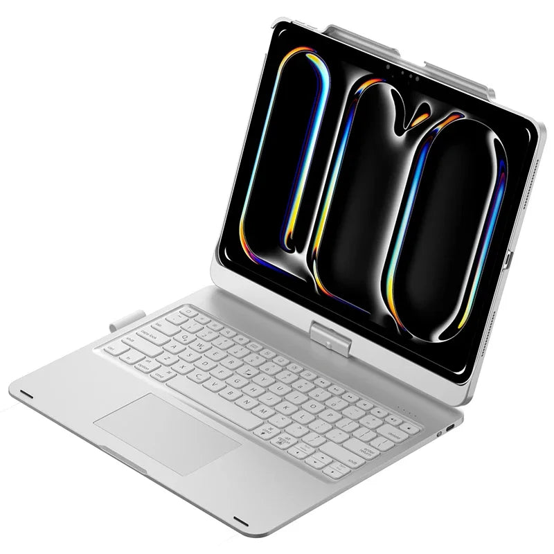 A silver laptop with an open display showing a rotating keyboard case for an iPad.
