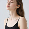 A woman is shown wearing upgraded open earbuds for a secure fit.