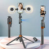 A tripod-mounted selfie stick with a camera, face tracking, and dual lights is displayed on a white surface.