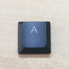 A keycap for a keyboard showing the letter A on a dark gray square key.