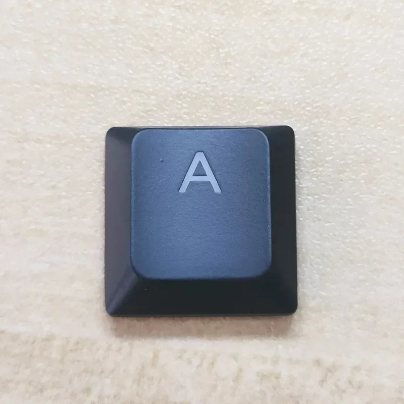 A keycap for a keyboard showing the letter A on a dark gray square key.