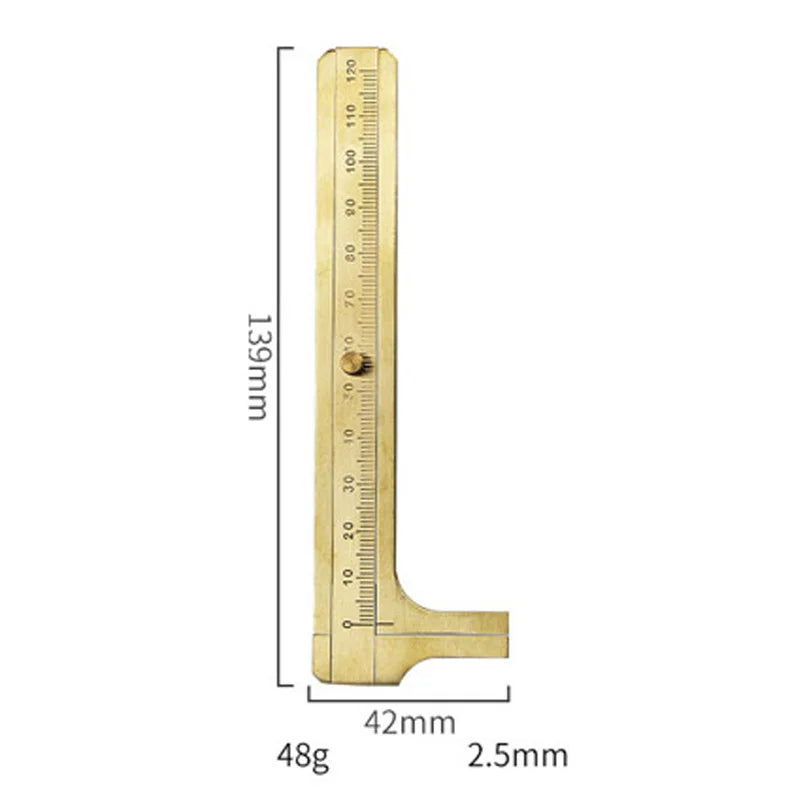 A brass drafting set with a ruler marked in millimeters and a 48g weight.