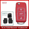 A red realistic fake car key hidden safe with a secret compartment shown in a close-up view.