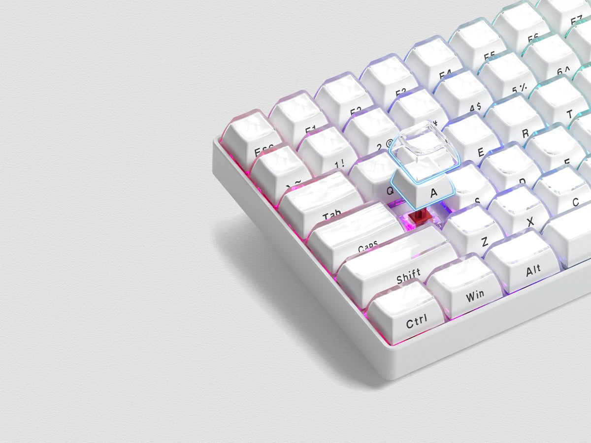 A close-up view of white custom printed jelly keycaps for a mechanical keyboard, showing various letter and function keys.