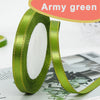 Army green satin ribbon rolled on and unrolled, showing a gold edge.