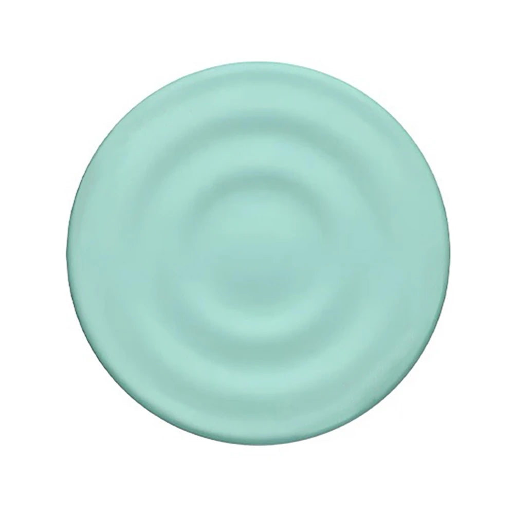 A light mint green ripple grip magnetic phone stand with a silicone finish.