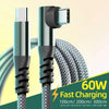 A close-up of a silver USB-C fast charging cable with a braided black jacket and a white connector tip.