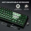 A close-up view of a black mechanical keyboard showing hot-swappable switches and lubricating tools.