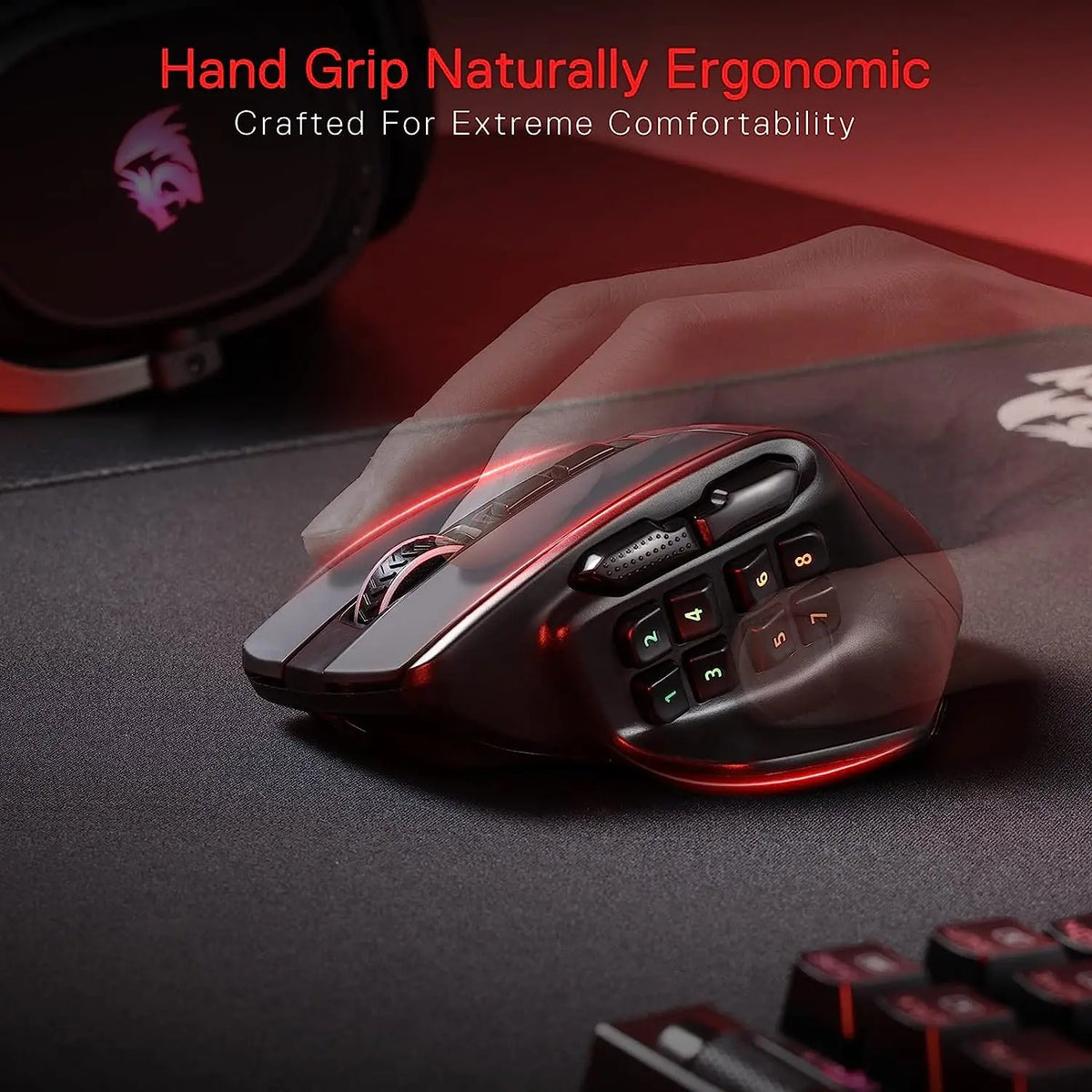 A close-up view of a black wireless MMO gaming mouse with red lighting resting on a dark surface.