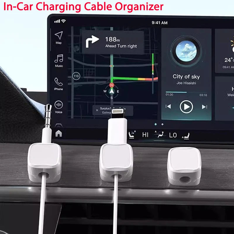Three white magnetic cable clips are shown next to a laptop screen displaying a map and navigation interface.