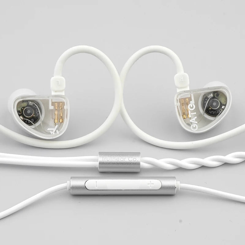White wired in-ear headphones with coiled cables and a detachable connector.