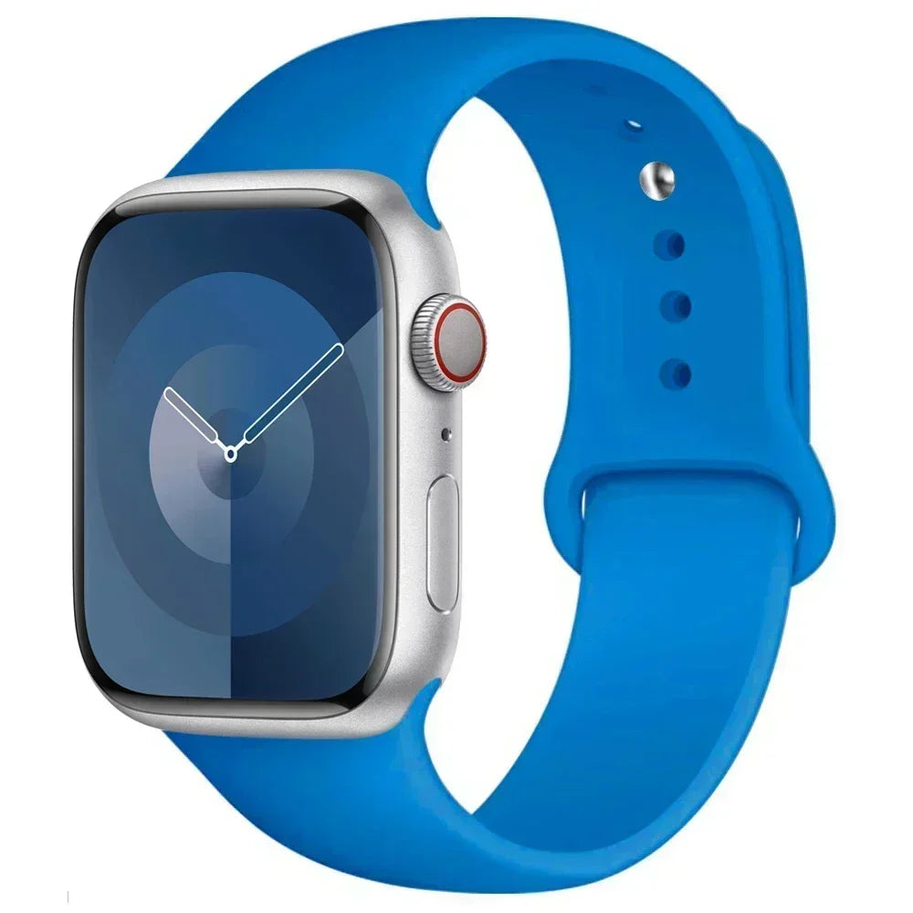 A blue silicone sport band worn around a silver Apple Watch.