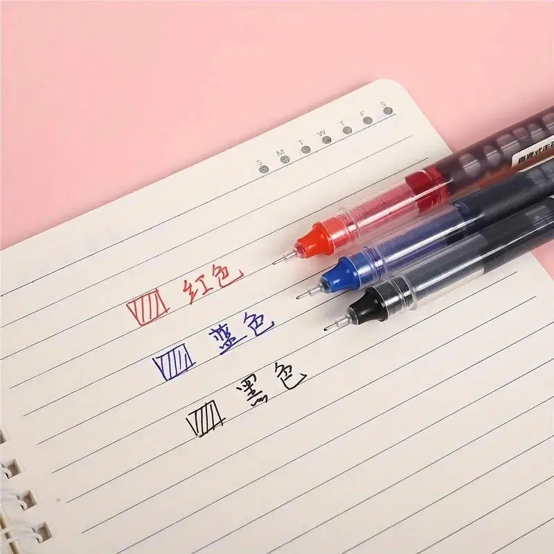 A set of precision gel pens in red, blue, and black writing on lined paper.