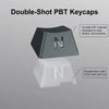 A close-up view of a double-shot PBT keycap set featuring black and white letters on a mechanical keyboard layout.
