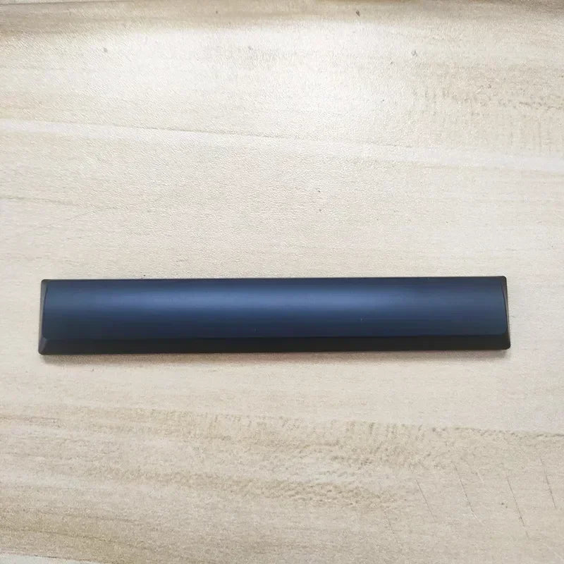 A dark blue replacement keycap for a Dell Alienware AW510K keyboard.