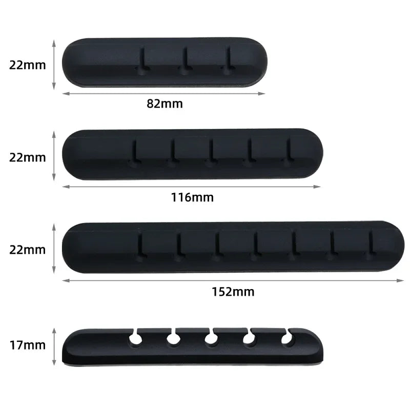 A set of black silicone cable organizers with various lengths and sizes.
