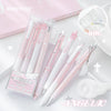A set of four pink and white Kawaii Pearl Angel gel pens with glitter accents displayed on a light surface.