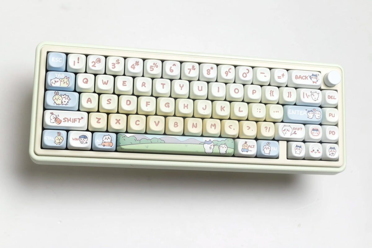 A close-up photo of a white mechanical keyboard featuring custom dye-sublimated PBT keycaps with cute animal designs.