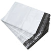 A stack of self-sealing poly mailers in white and black are shown from an angled view.