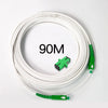 A coil of 90 meter single-mode fiber optic cable with green connectors.