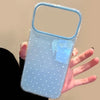 A clear blue silicone phone case with small dots and a flexible plastic cover is held in a hand.
