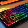 A close-up view of a mechanical keyboard with translucent keycaps displaying a vibrant rainbow light effect.