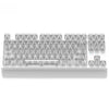 A row of clear and frosted mechanical keyboard keycaps arranged in a tray.