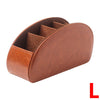 A brown PU leather remote control holder with five compartments shown from the top.