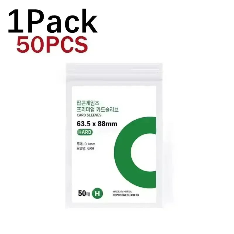 A pack of 50 transparent protective card sleeves with a green C shape visible on the packaging.