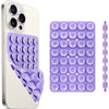 A white smartphone case and a purple silicone suction cup mount with multiple suction cups.