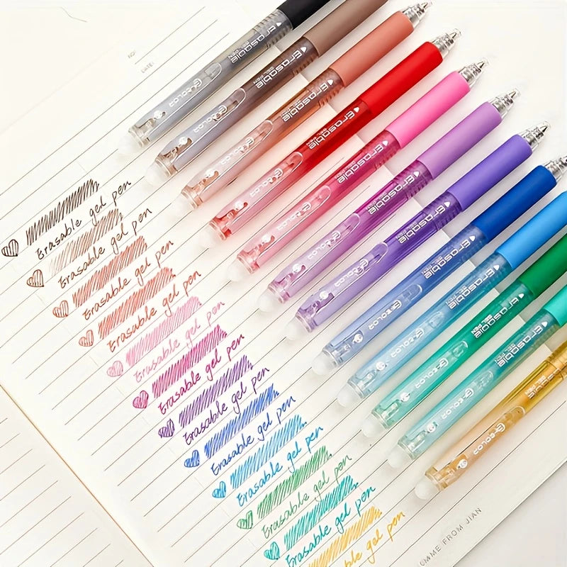 A collection of 36 colored erasable gel pens lined up on a sheet of paper.