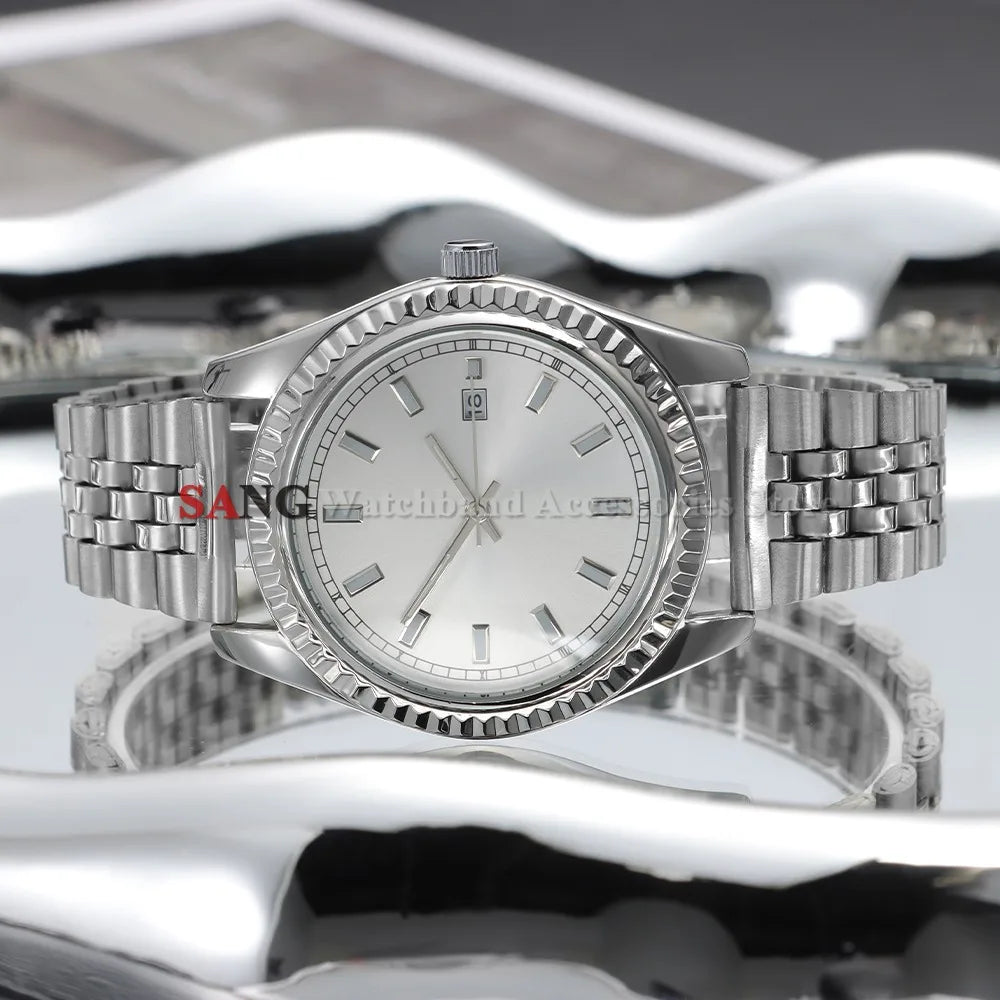 A polished stainless steel watch with a silver dial and bracelet is displayed on a reflective surface.