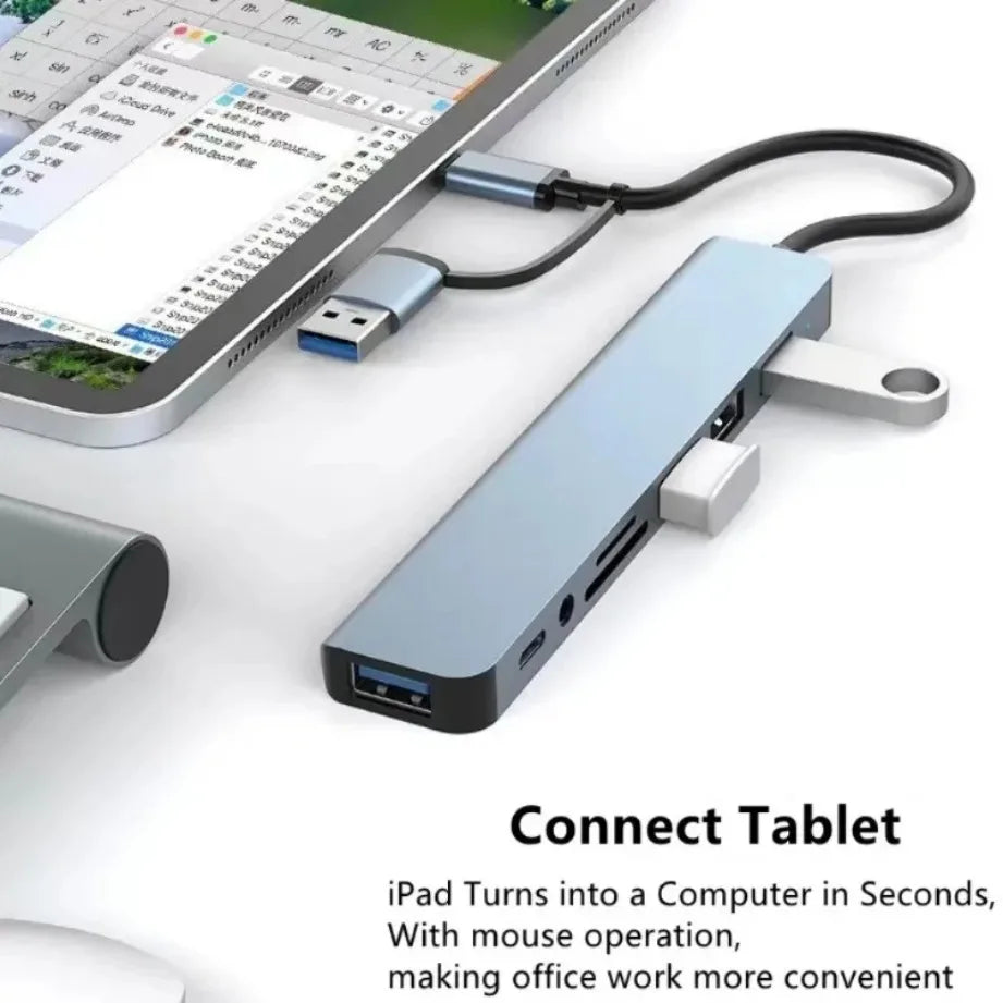 A blue USB-C hub connects an iPad to a computer, turning the tablet into a computer with mouse operation.