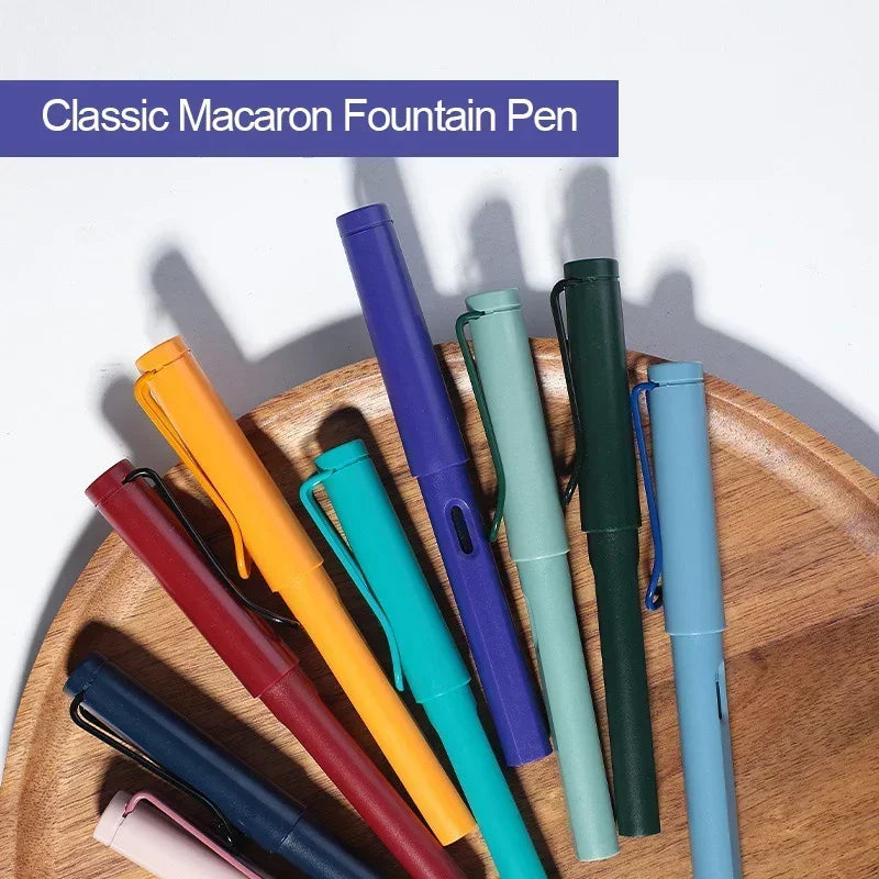 A collection of three classic macaron fountain pens in various colors, including purple, orange, green, and blue, displayed o