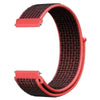 A close-up view of a pink nylon loop watch strap with a textured pattern.