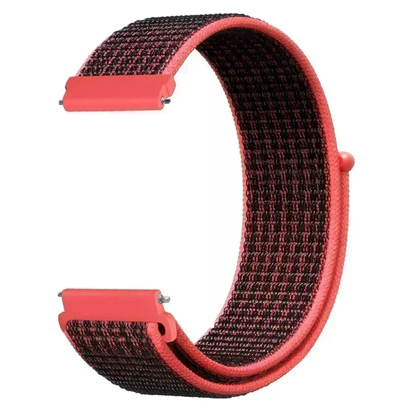 A close-up view of a pink nylon loop watch strap with a textured pattern.