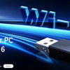 A black Tenda Wi-Fi 6 USB adapter is shown next to a PC, with blue light graphics indicating a Wi-Fi connection.