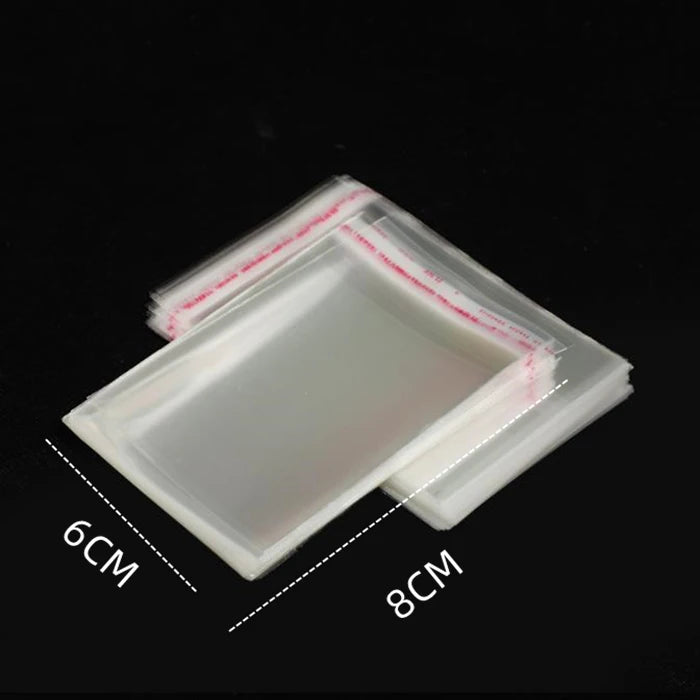 A transparent plastic bag with a white sealing strip is shown, measuring 6cm by 8cm.